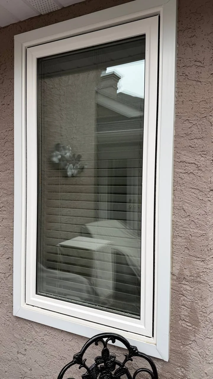 Clean residential window with white frame
