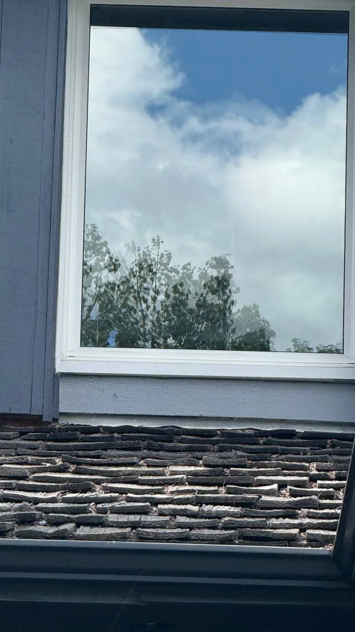 Clean window reflecting the sky